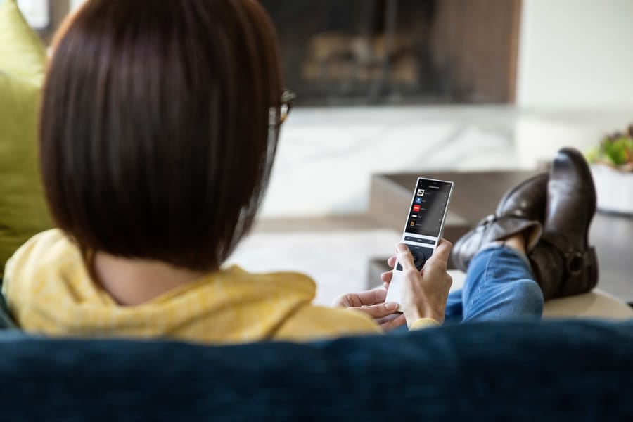 Family relaxing, home controlled from one app