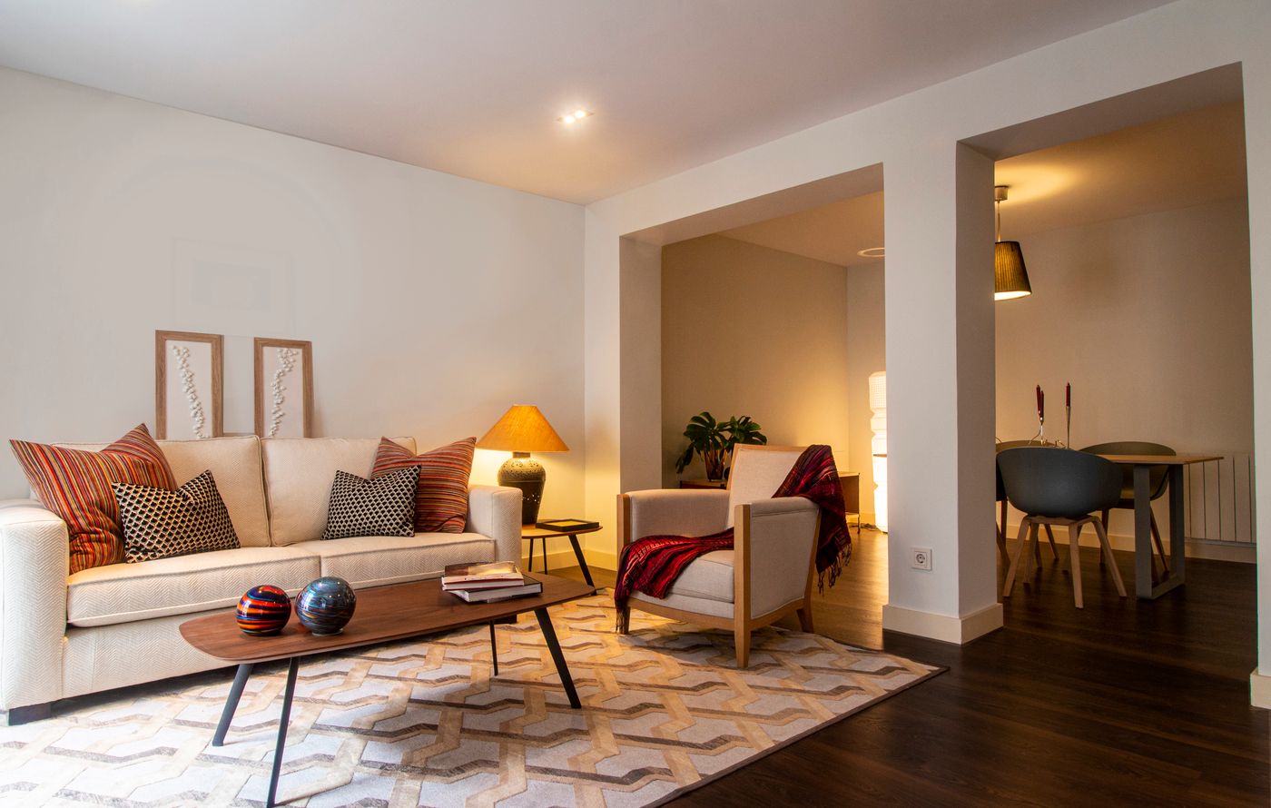 Warm, modern living room at dusk
